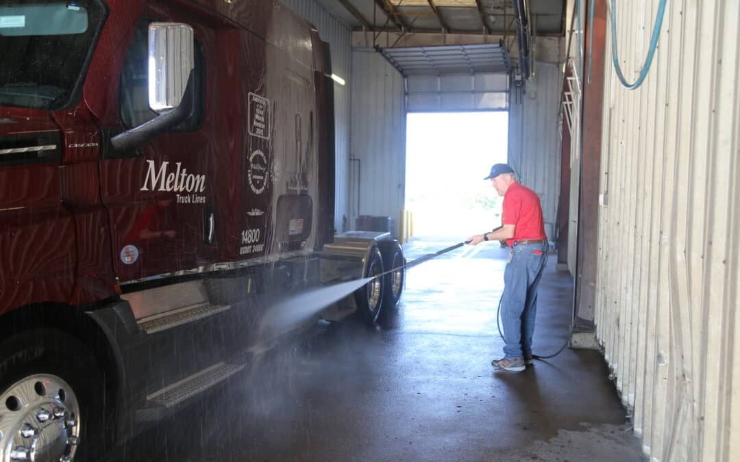 Melton CEO cleaning flatbed semi truck