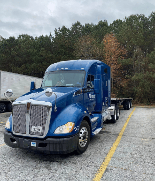 A Melton truck parked in a truck stop space