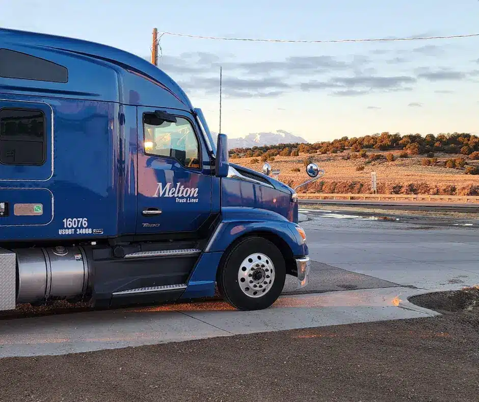 Melton truck parked in front of a hill