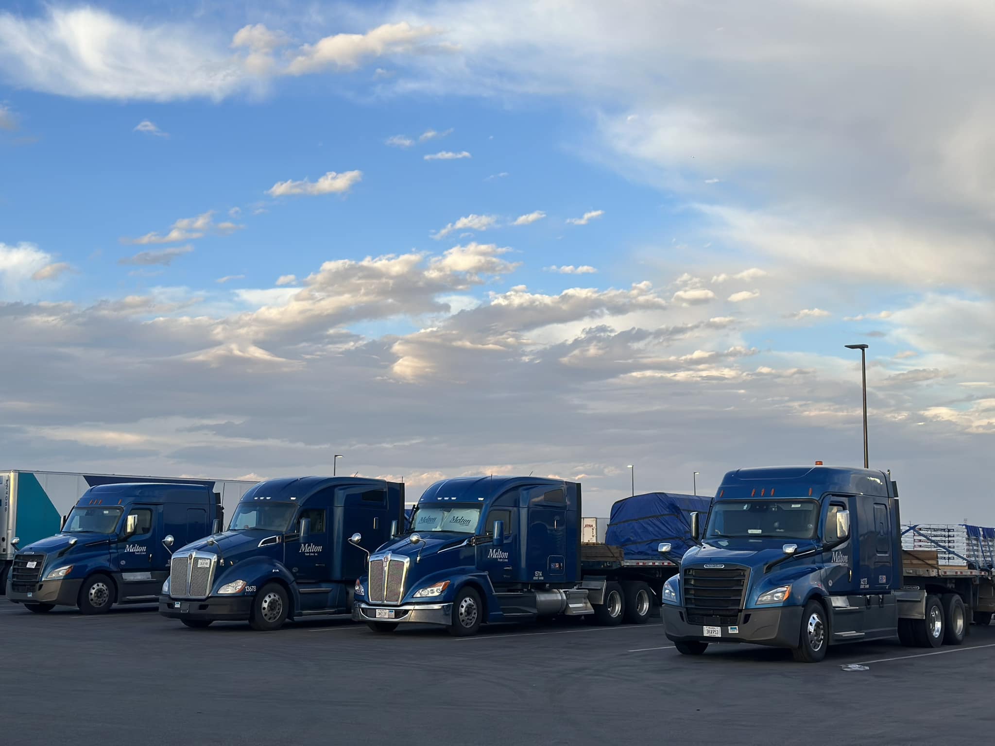 Melton trucks parked in the sunset