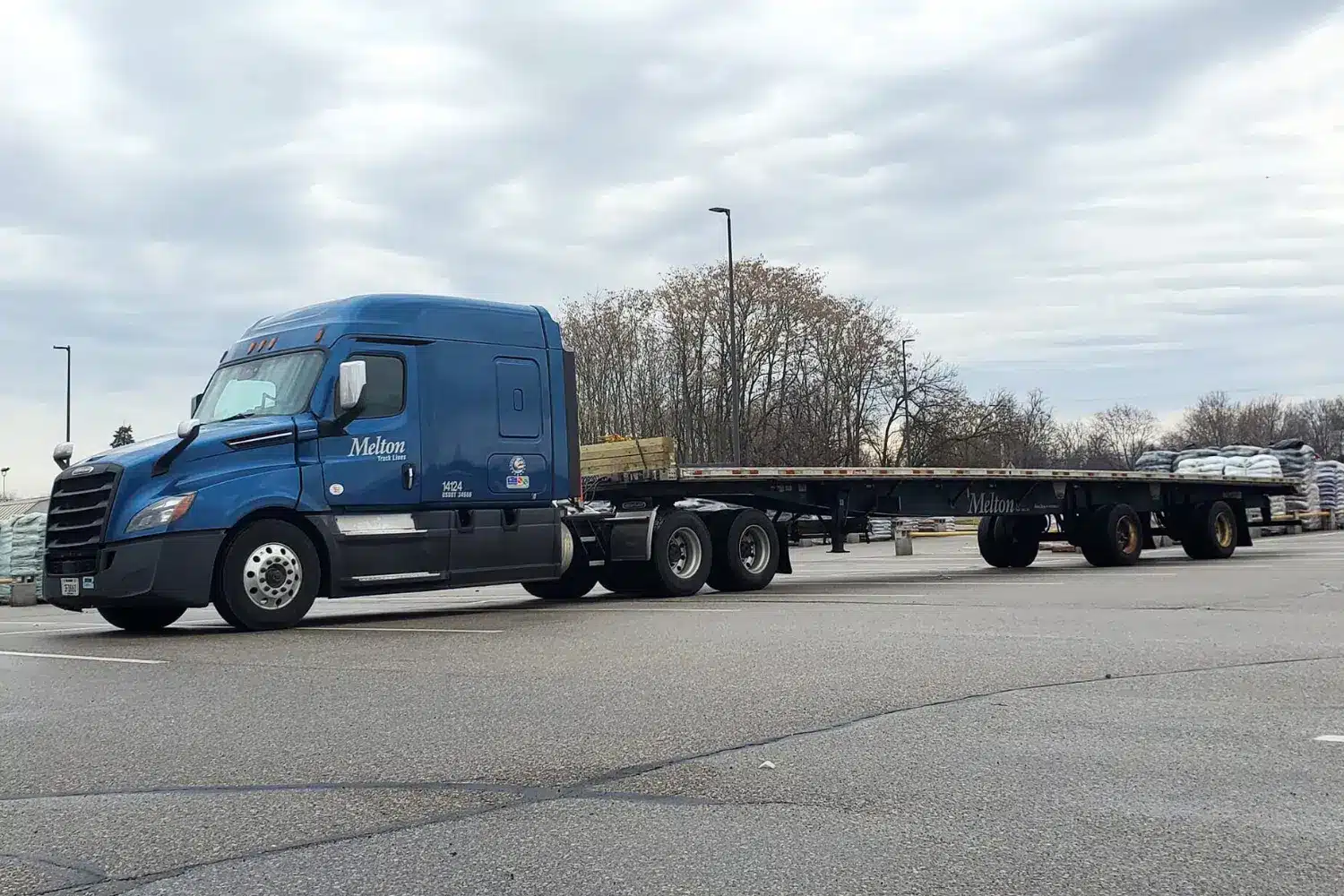 Melton truck with a flatbed trailer