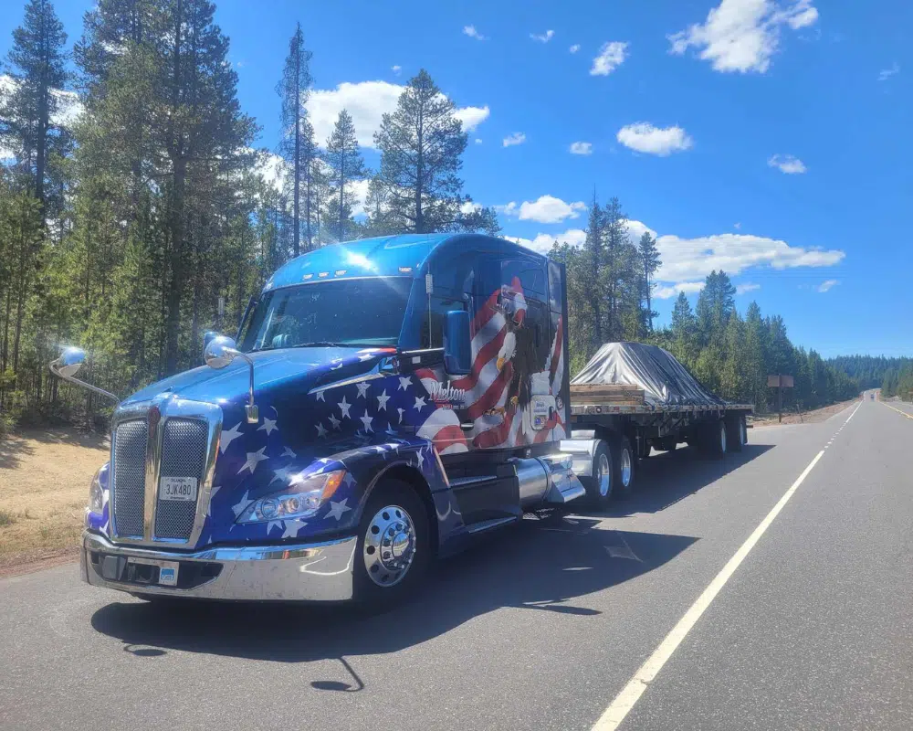 Melton truck with an American flag wrap