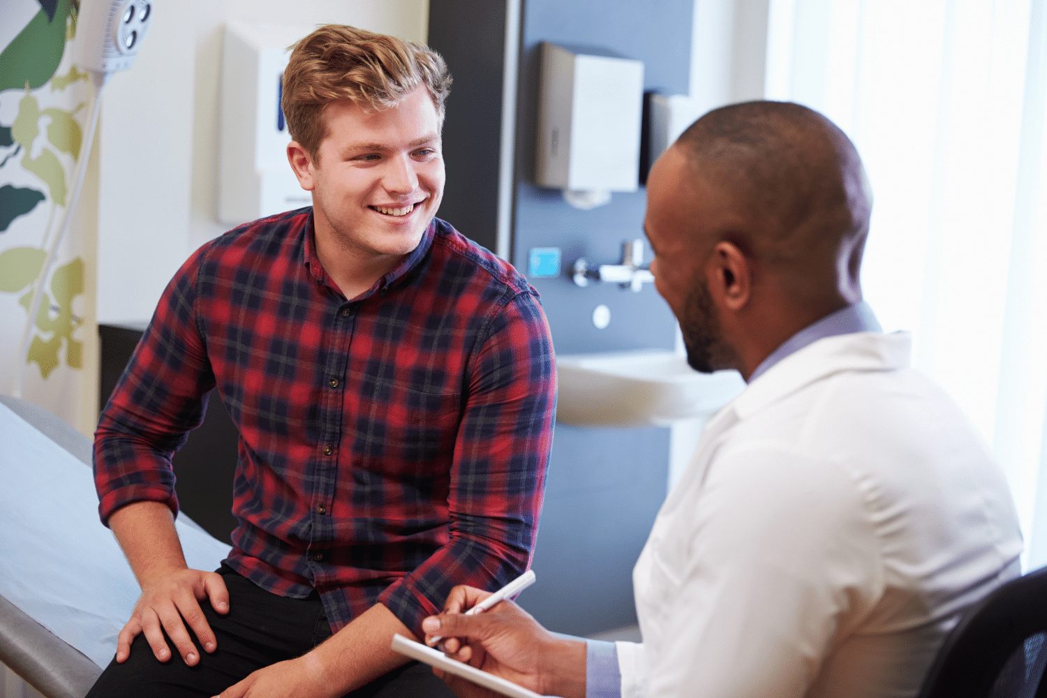 A man speaking to his doctor in an office