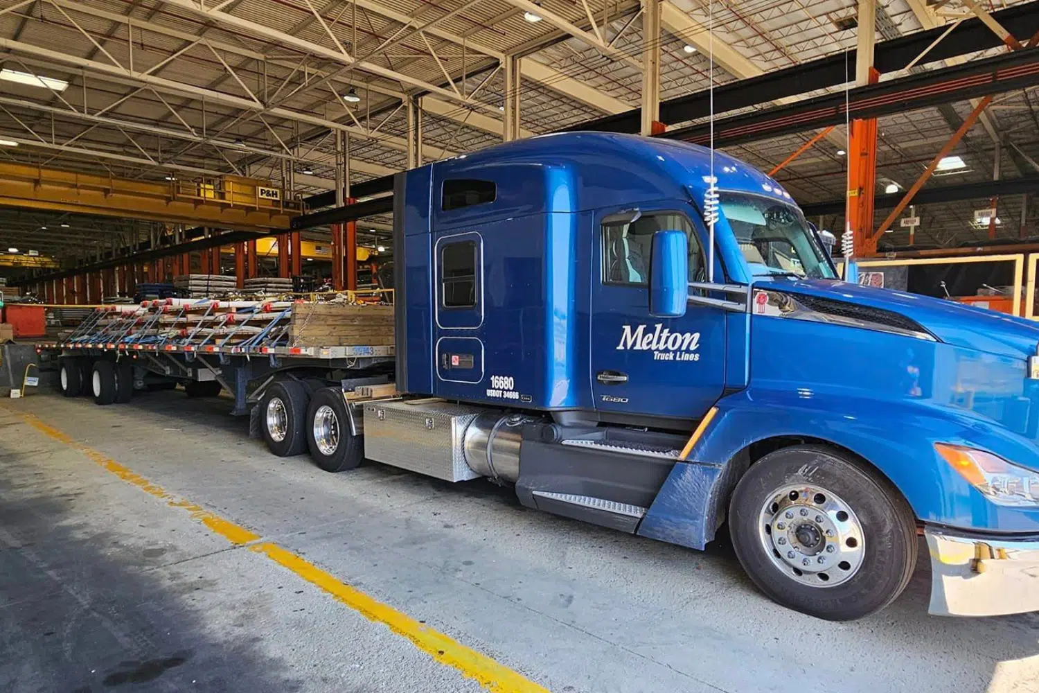 A Melton truck loaded with construction materials