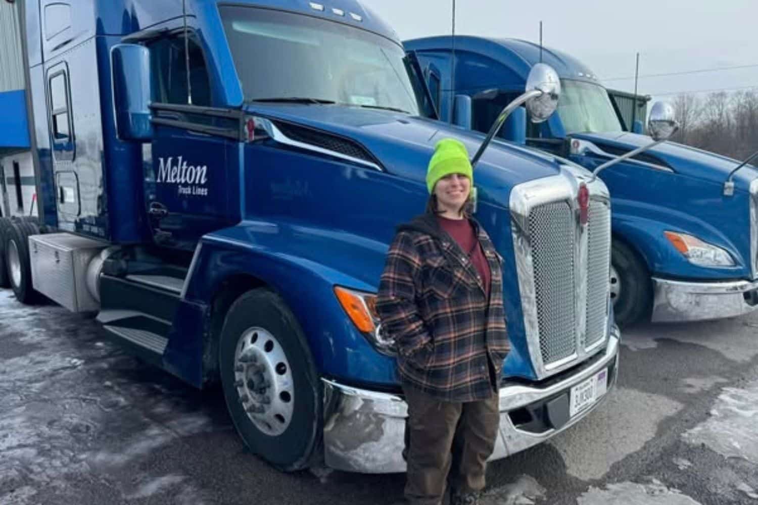A Melton driver standing in front of her truck