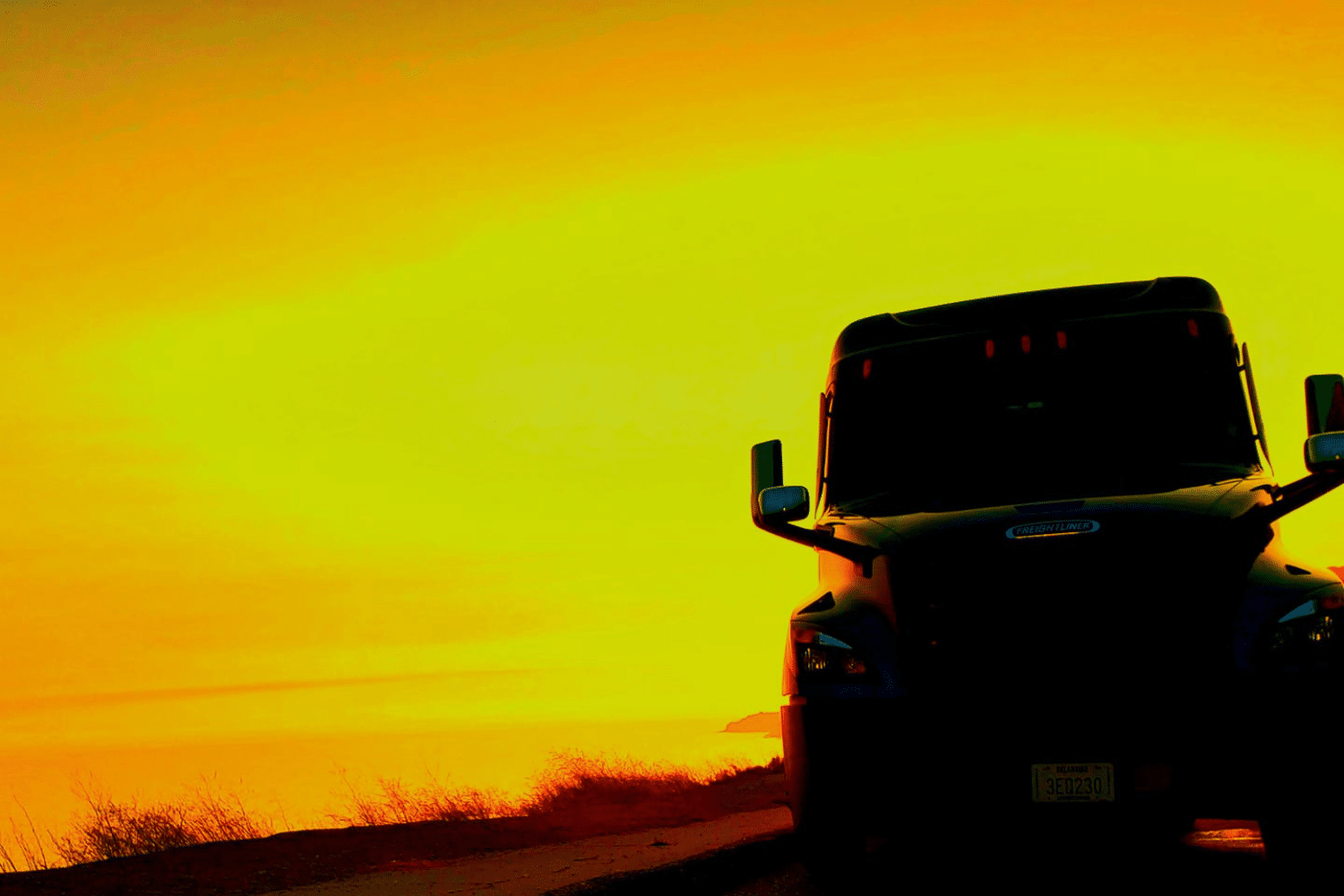 A Melton truck parked in the sunset